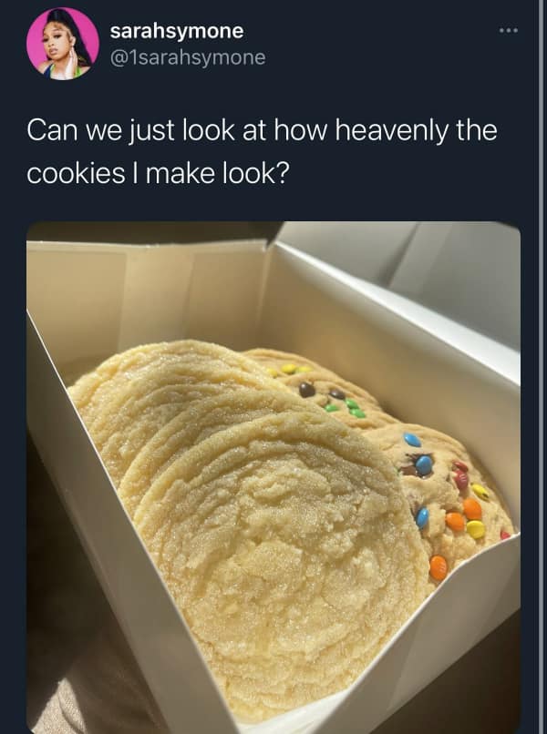 A cardboard bakery box filled with exceptionally thin, glistening, underbaked sugar cookies is featured in a viral dessert meme debate about perfect baking textures.