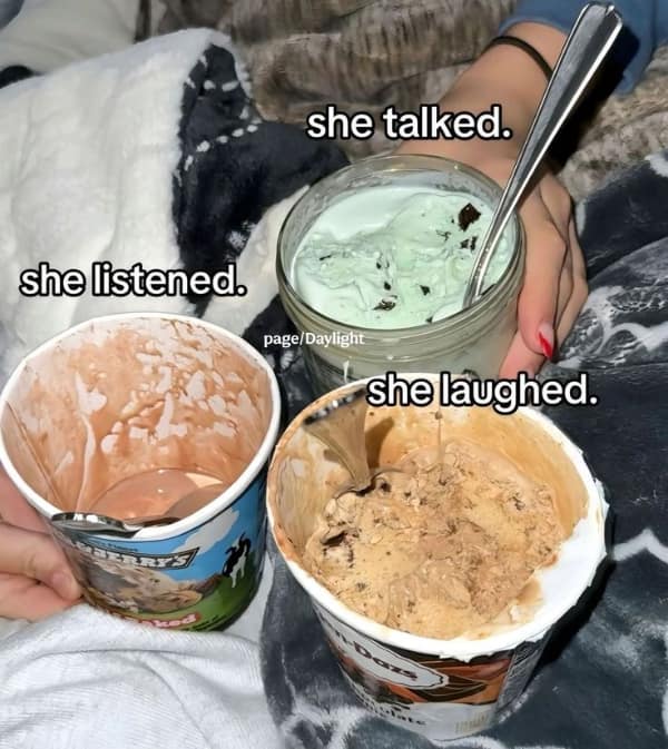 Three open pints of premium ice cream including Ben & Jerry's and Häagen-Dazs sit nestled on a cozy bed blanket as a relatable dessert meme about coping mechanisms.