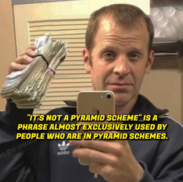 A man holding a massive stack of cash with a shower thought about the phrase pyramid scheme.