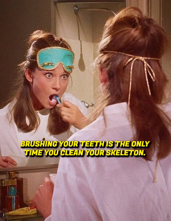 Audrey Hepburn brushing her teeth in a mirror with text about cleaning your skeleton.