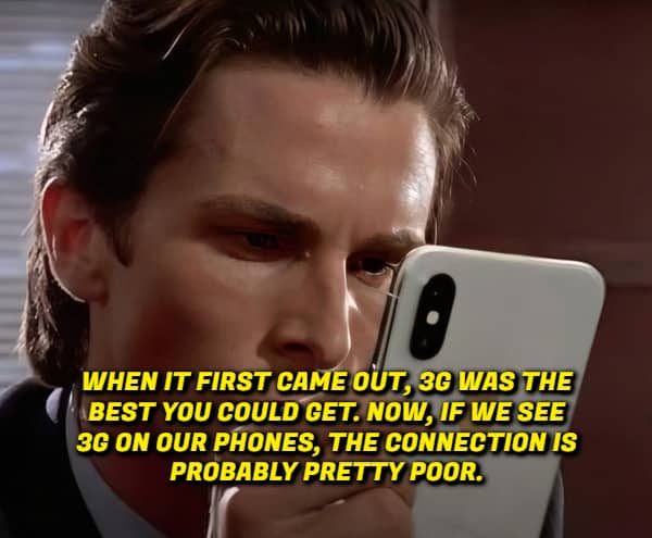 Christian Bale as Patrick Bateman looking at a phone with text about 3G connection speeds.