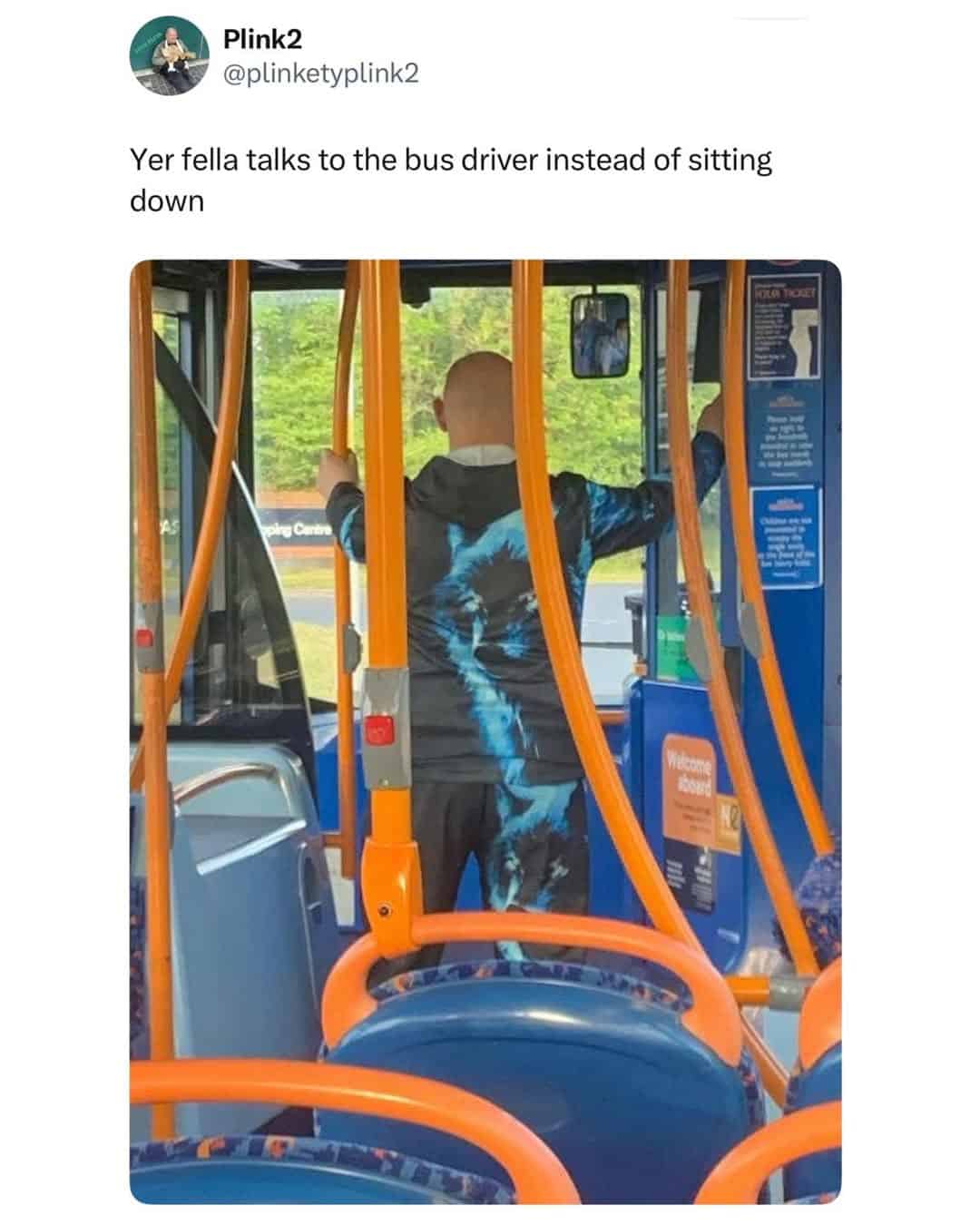 A man standing at the front of a bus to chat with the driver instead of sitting illustrates a classic social trope in this funny British tweet.