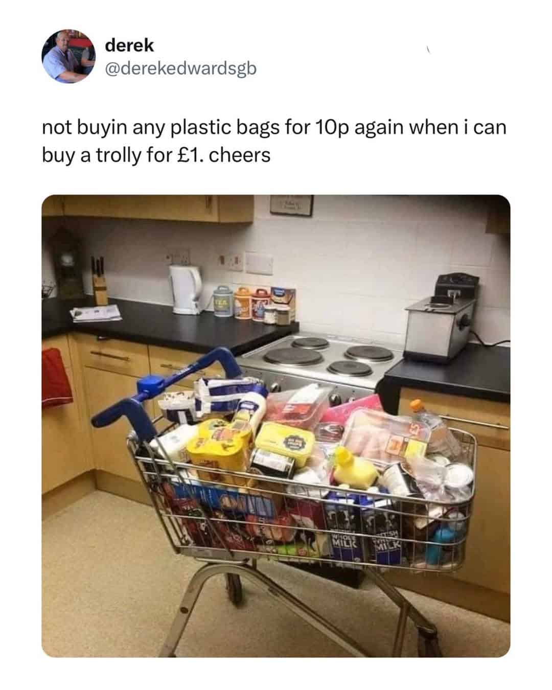 A photo of a full supermarket shopping trolley sitting in a domestic kitchen as a legendary British meme about saving 10p.