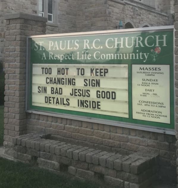 A funny church sign for St. Paul's R.C. Church where the staff gave up due to heat, displaying the simplified message: SIN BAD JESUS GOOD DETAILS INSIDE.