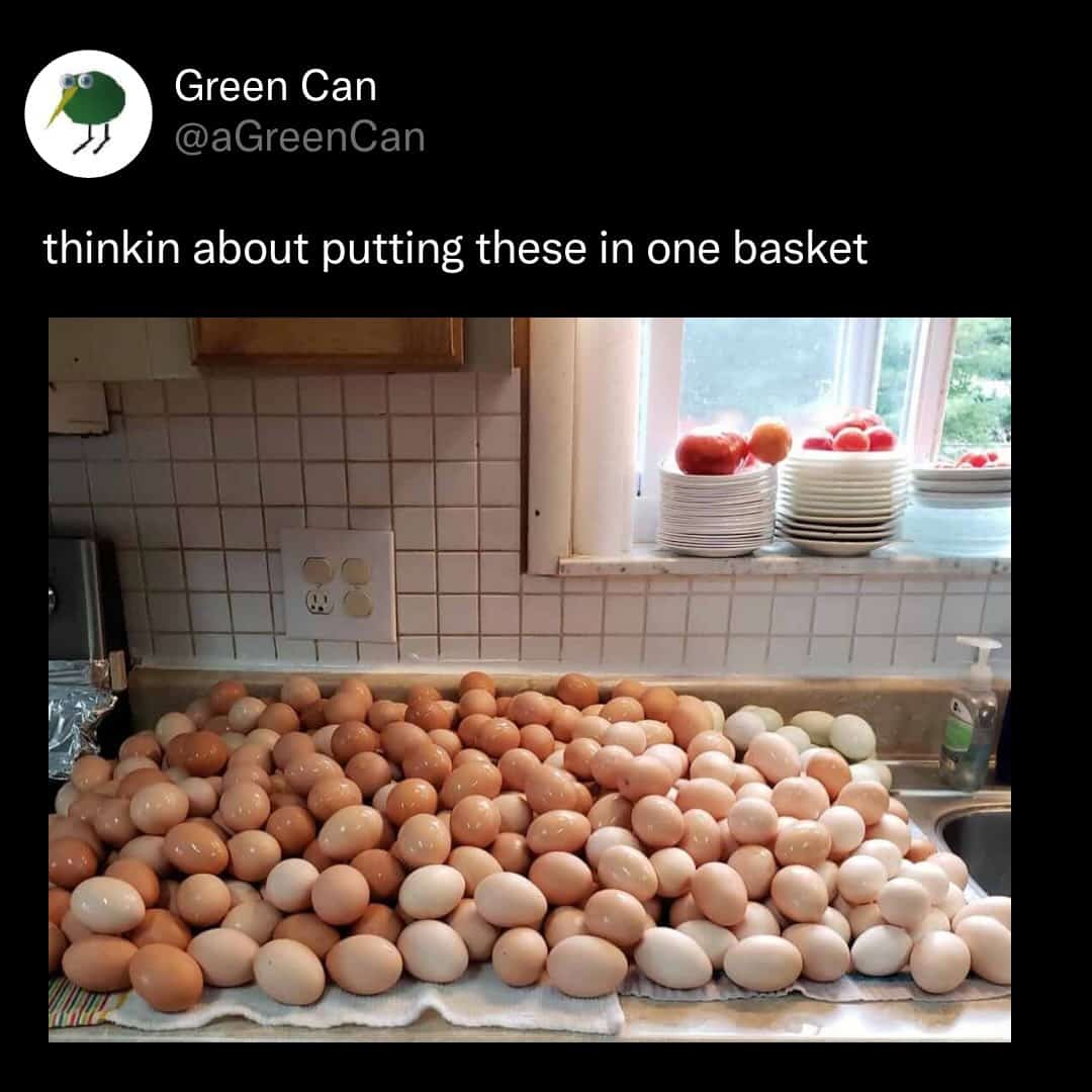 A massive pile of raw brown and white eggs covering a kitchen counter next to a sink.