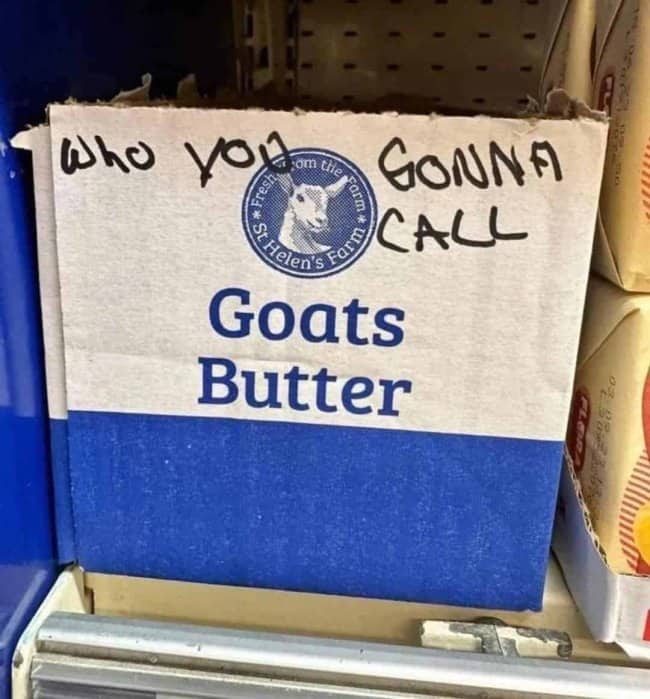 Hand-written graffiti on a cardboard box transforms a dairy product label into a Ghostbusters joke.