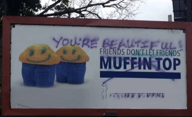 Vandalism on a plastic surgery billboard changes a weight loss message into body positivity.