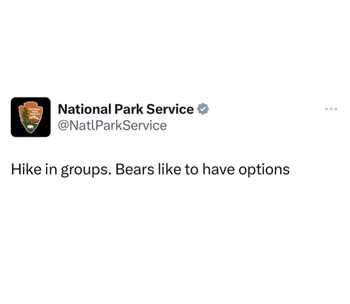 An official National Park Service social media update delivers a brilliant funny hiking meme with the darkly comedic warning: "Hike in groups. Bears like to have options."