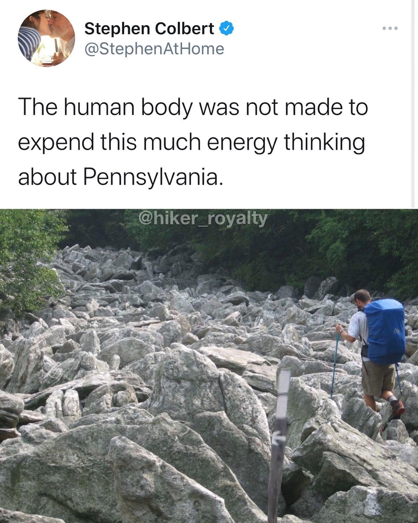 A real-world trail photo captures a funny hiking meme detailing a backpacker scrambling across an arduous field of jagged rocks, paired with a witty Stephen Colbert quote mocking the extreme physical toll of navigating Pennsylvania terrain.