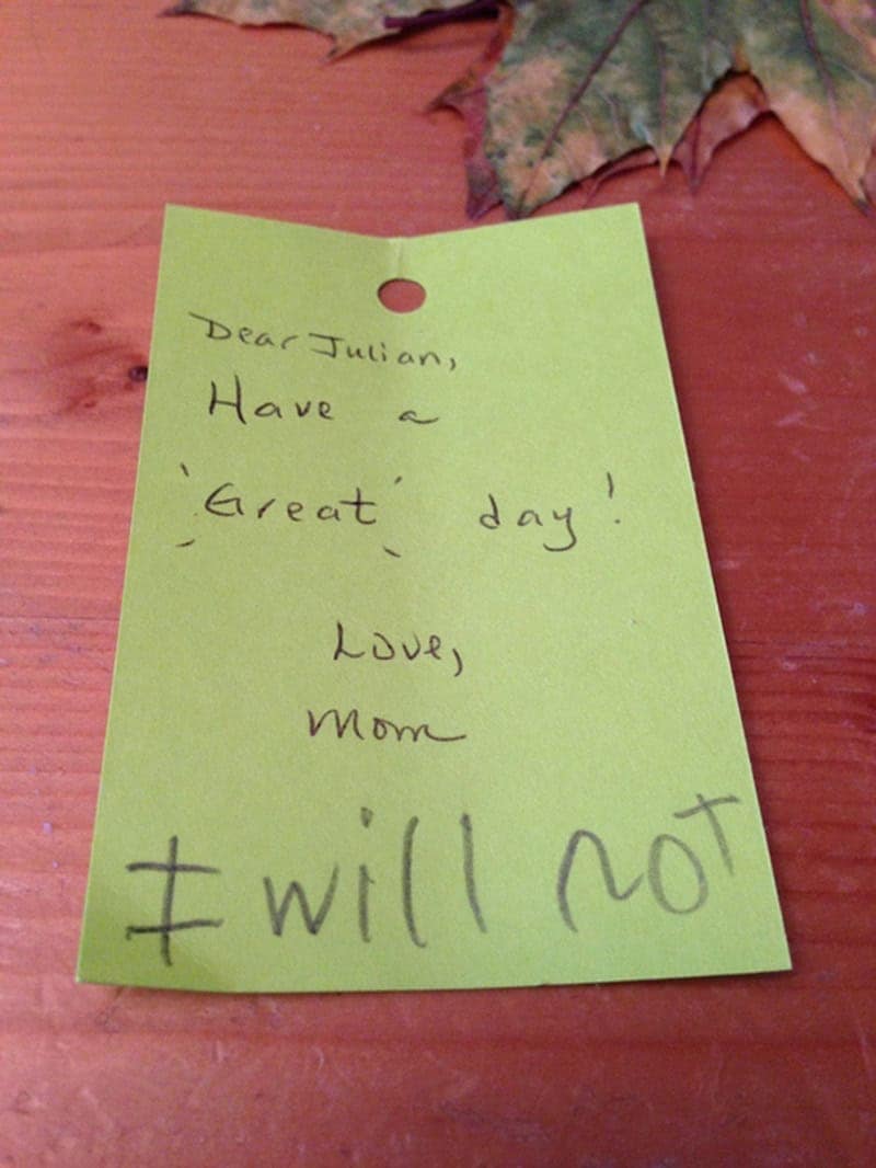 A neon green sticky note from a mother wishing Julian a "great day," which Julian has aggressively updated with a giant, defiant scrawl: "I will not."