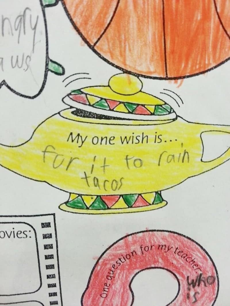 A colorful worksheet featuring a genie lamp where a child has written their one and only wish: "for it to rain tacos."