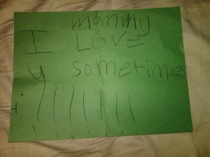A funny kids note written in pencil on green construction paper that reads "mommy I Love u sometimes."