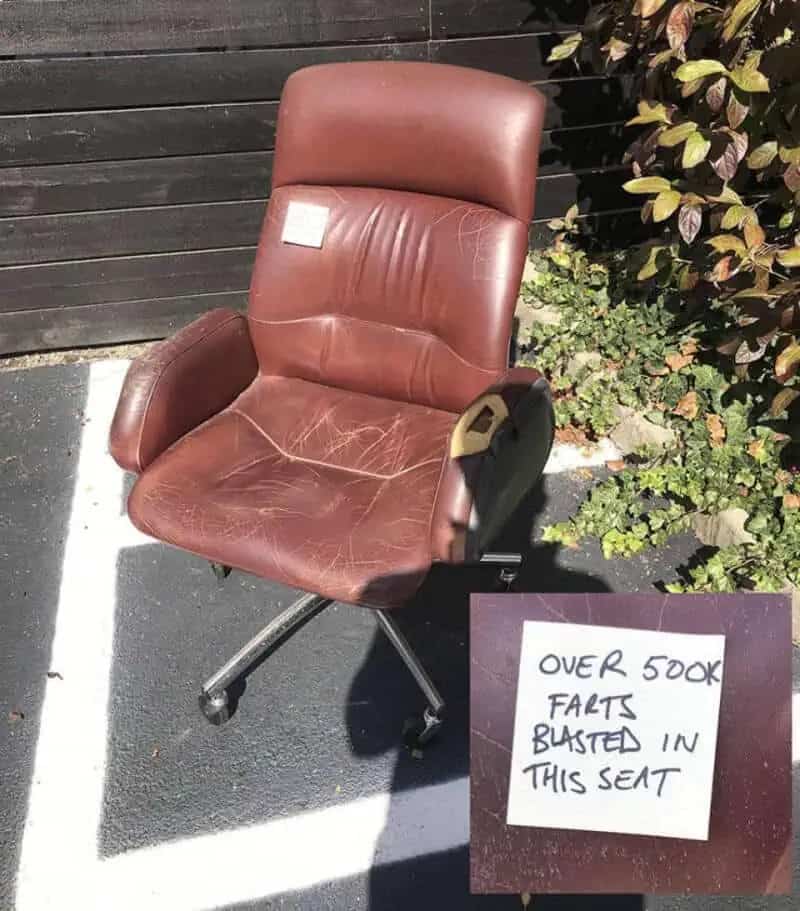 Funny picture of a worn-out office chair for sale with a gross, exaggerated handwritten note.