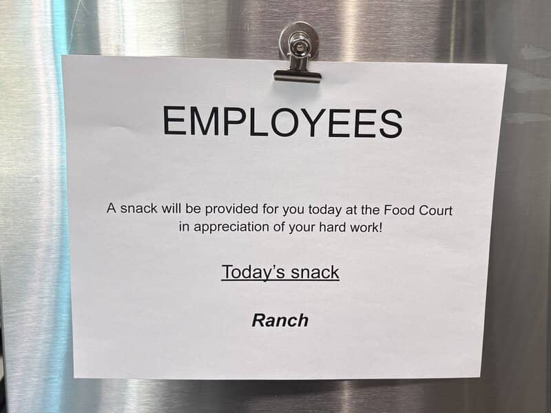 Employee appreciation sign pinned on a wall stating that today's provided snack is ranch dressing.