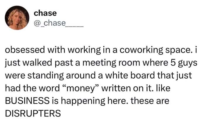 Tweet describing a coworking space meeting where five men stand around the single word money.