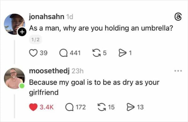 screenshot of a Threads exchange where a user questions why a man would hold an umbrella. The reply delivers a savage funny roast stating that his goal is to stay as dry as the challenger's girlfriend.
