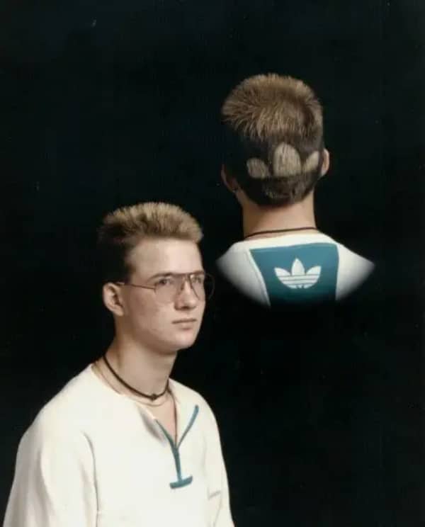 Double exposure school portrait of a teenager with a shaved corporate logo in his hair.