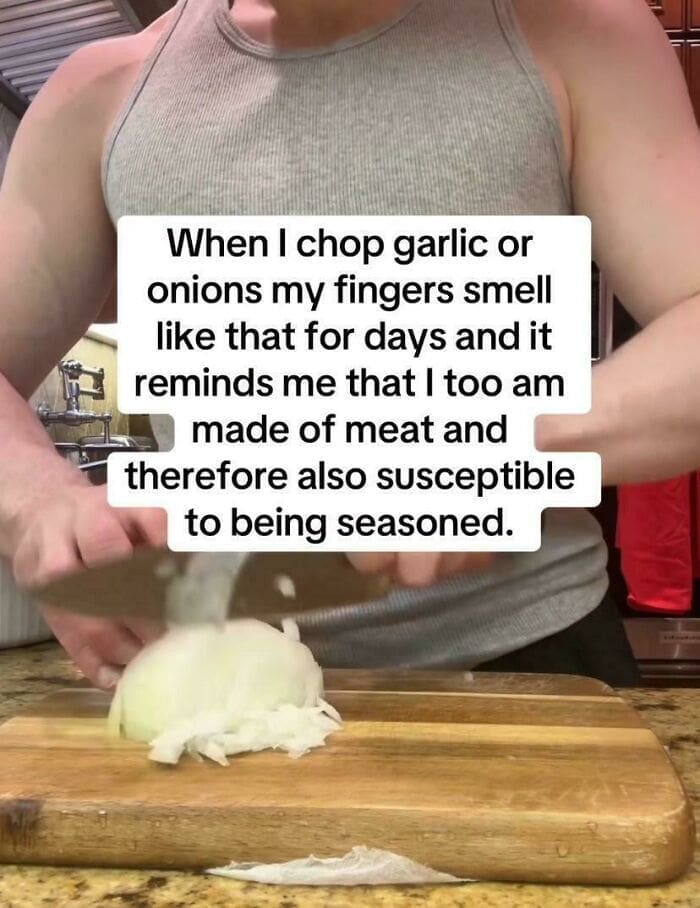 Person chopping a raw white onion with text about humans being made of meat.
