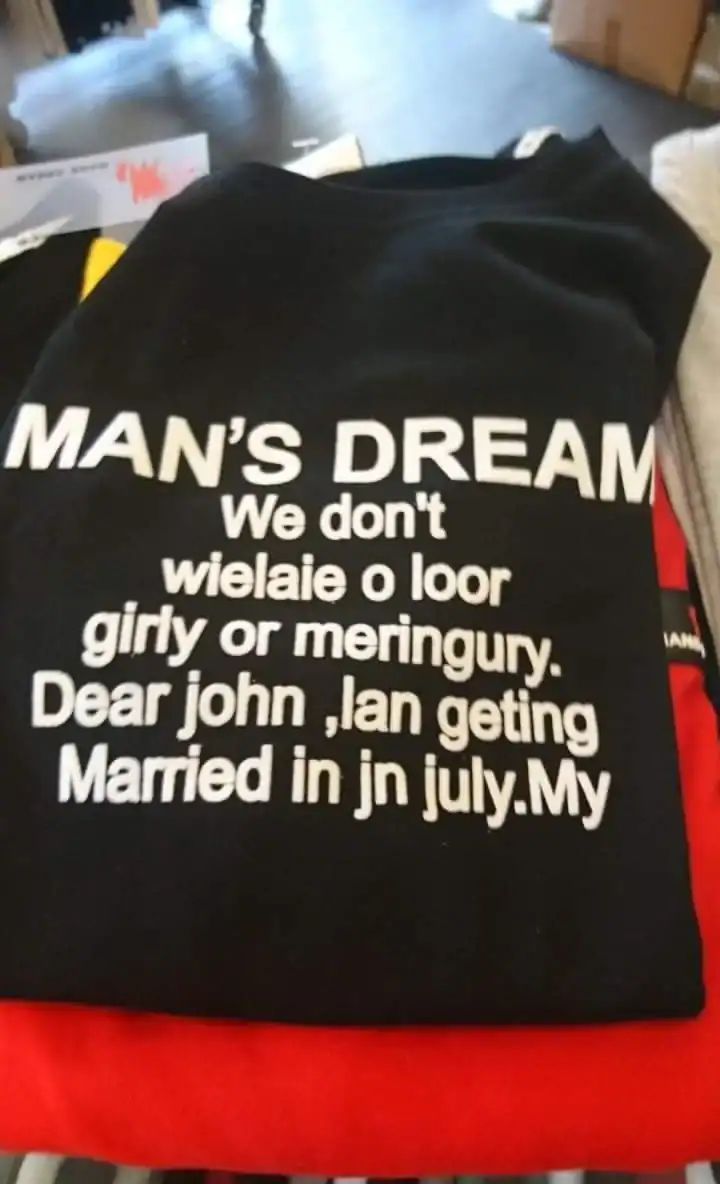 Black t-shirt covered in completely incoherent, gibberish English text about a man's dream.
