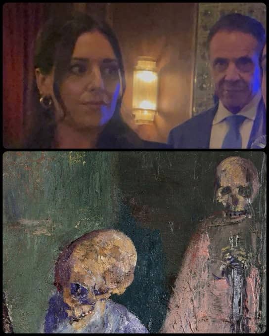 A candid shot of a woman and Andrew Cuomo next to a skeletal oil painting.