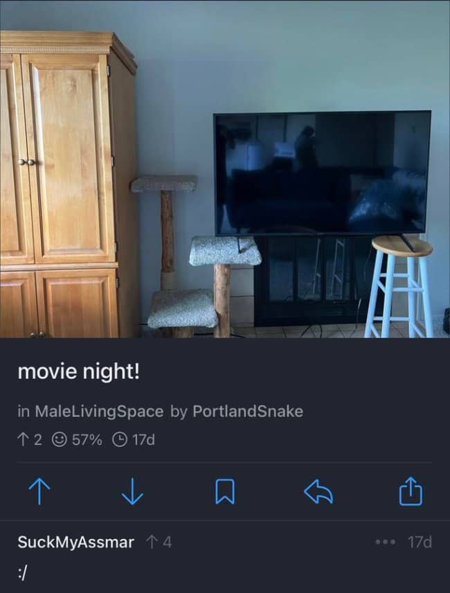 A flat screen television perilously balanced with one leg on a cat tree and the other on a wooden bar stool.