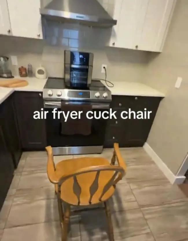 A kitchen photo in a meme dump showing a lone wooden chair placed directly in front of an air fryer on a stove, captioned as the "air fryer cuck chair."