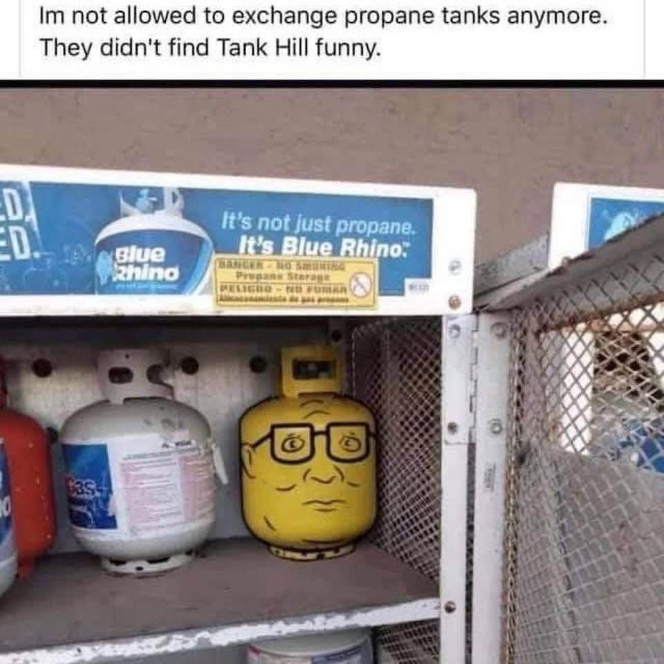 A funny pop-culture pun photo in a meme dump shows a Blue Rhino gas exchange cage containing a propane tank custom painted to look exactly like Hank Hill’s face.