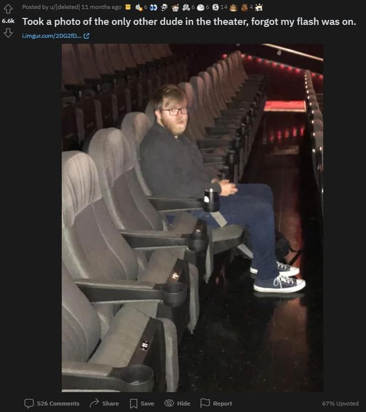 An absolute social nightmare captured for this meme dump displays an archived Reddit thread photo where a moviegoer attempted to stealthily photograph a stranger in a completely empty cinema room, only for their phone's flash to go off and trap them in a direct glare of mutual panic.