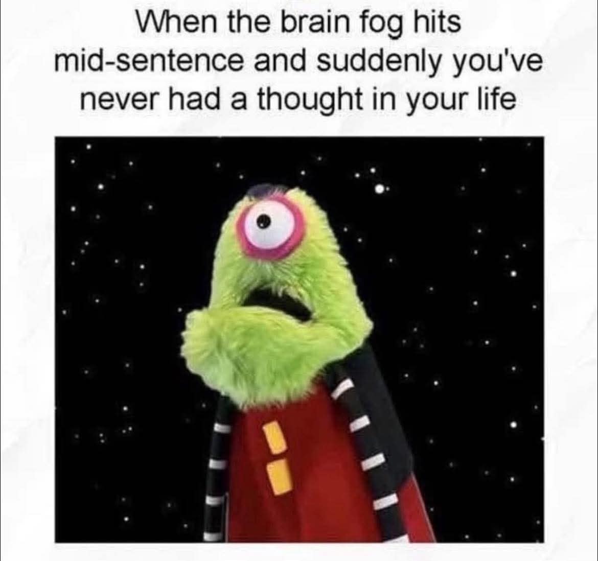 meme dump entry showing a one-eyed green puppet Cyclops staring blankly into a starry space background. The text describes the sudden "brain fog" that makes you feel like you’ve never had a single thought in your life.