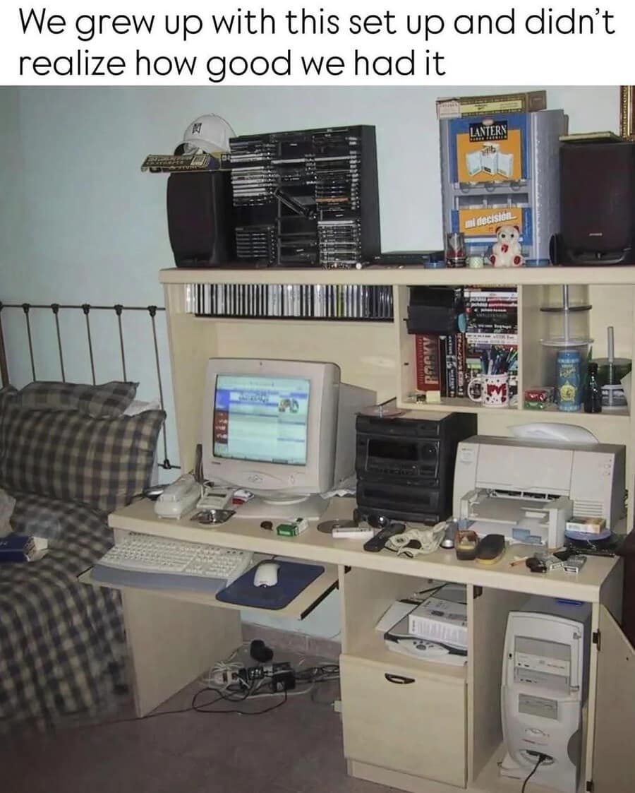 A nostalgic 90s bedroom computer desk with a CRT monitor and towers of CDs captures the retro aesthetic of this funny meme.