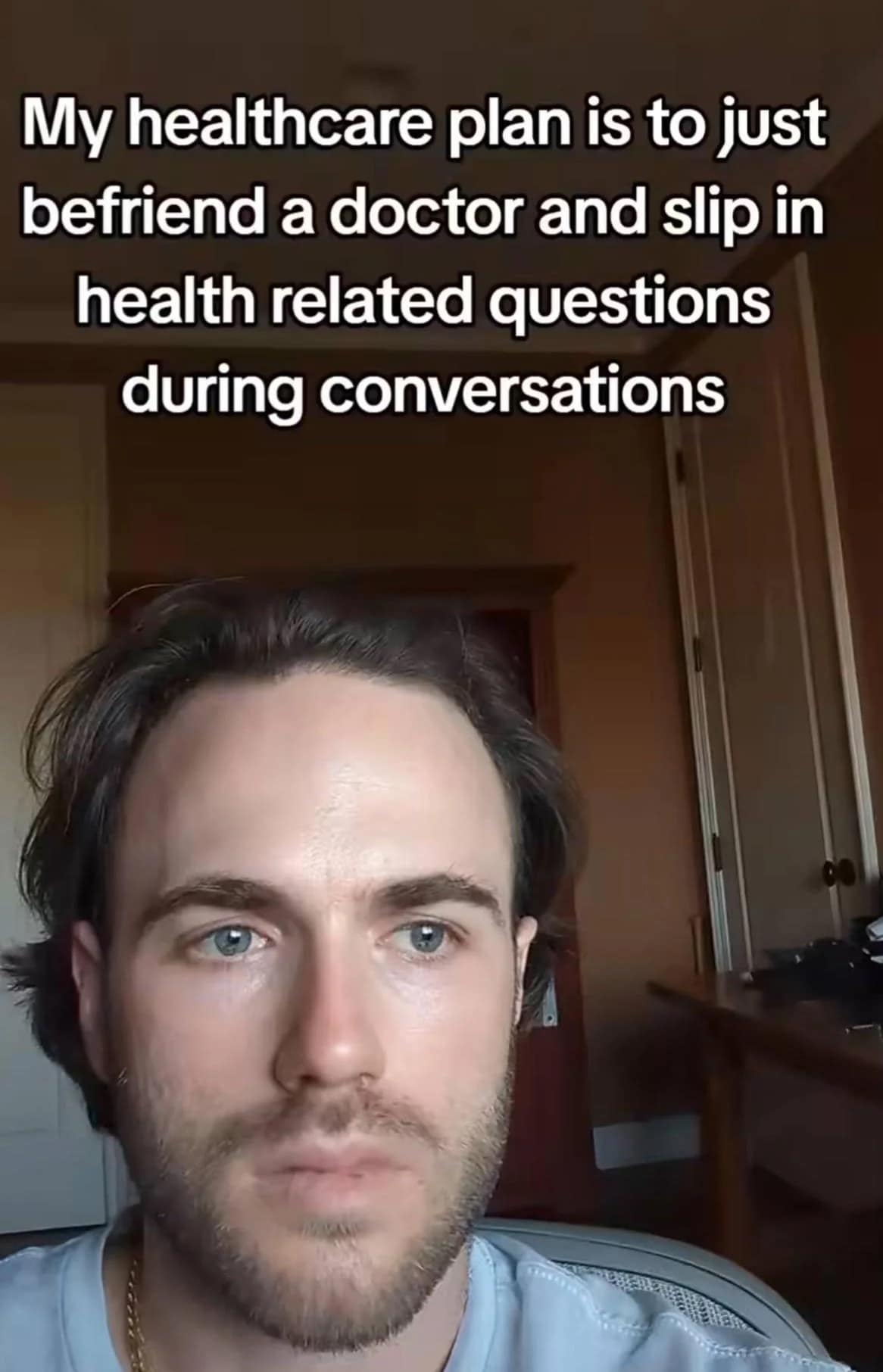 A video screenshot from a popular meme dump tracks a pensive young man with text overlay outlining a budget healthcare plan to simply make friends with a doctor and slip medical questions into regular conversations.