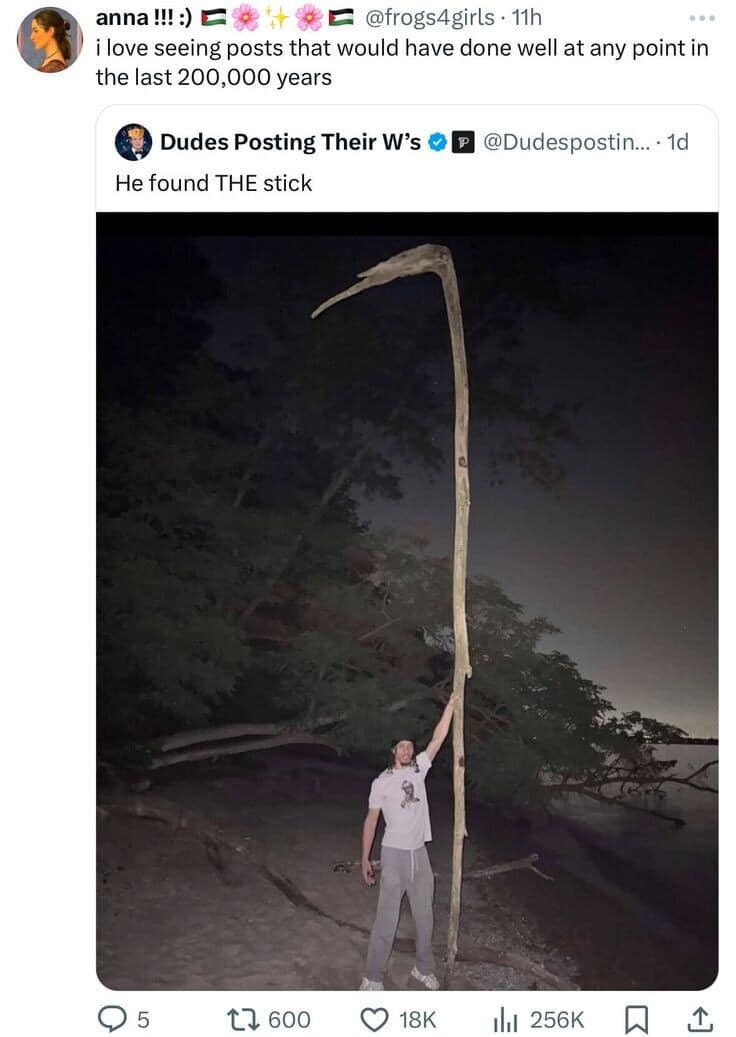 A funny meme showing a man holding a massive, scythe-shaped stick on a beach at night, celebrating a "win" that would have been respected 200,000 years ago.
