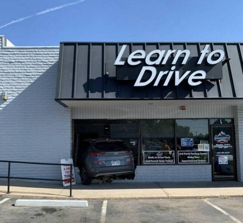A gray Hyundai SUV crashed halfway through the glass windows of a brick "Learn to Drive" training facility makes for an incredibly ironic addition to this online meme dump.