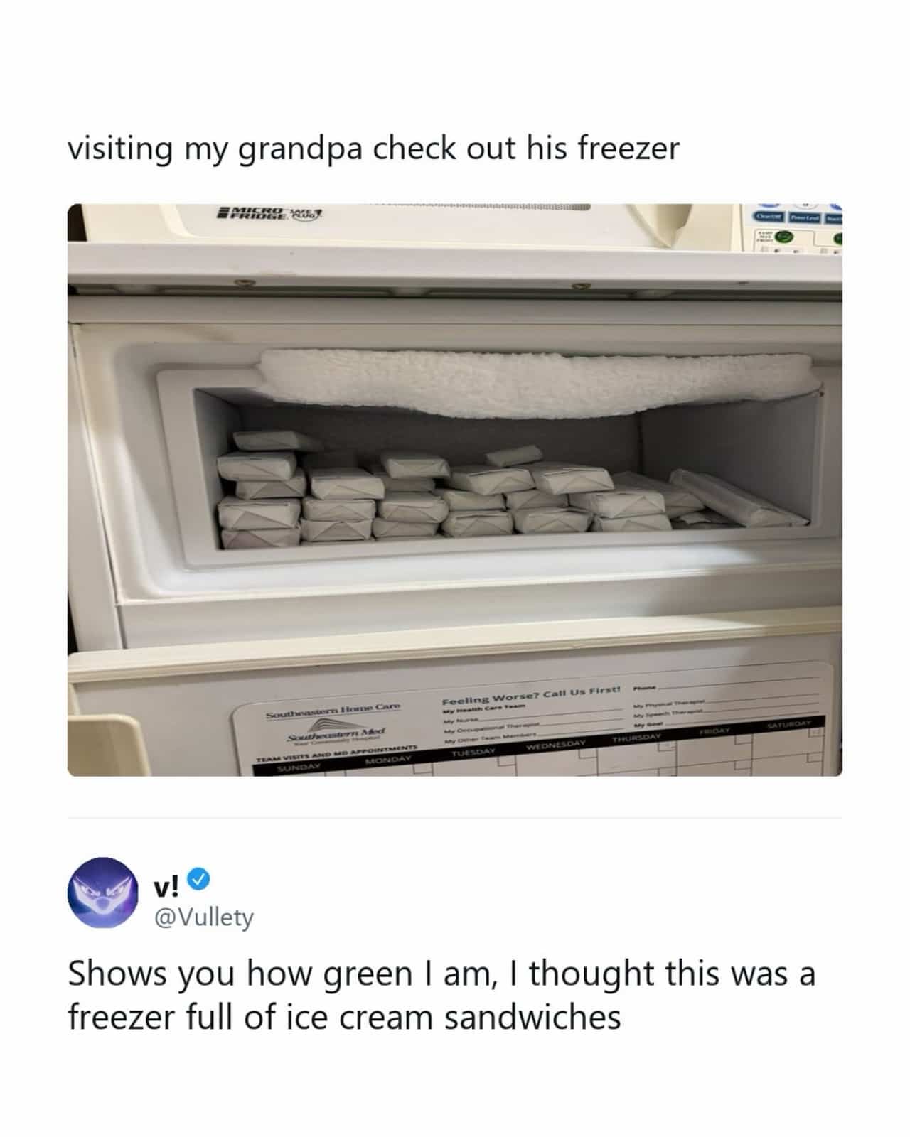 Medical freezer stocked with small white wrapped packages resembling a collection of ice cream sandwiches.