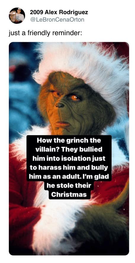 A movie meme with a close-up of Jim Carrey’s live-action Grinch looking skeptical, featuring text that questions why he is considered the villain when Whoville actively bullied him into isolation and continued to harass him as an adult.