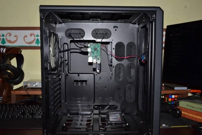 A massive full-tower PC case containing only a tiny Raspberry Pi board and a single SSD.
