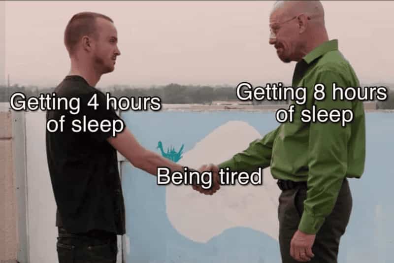 Breaking Bad characters Jesse Pinkman and Walter White shaking hands over being tired.