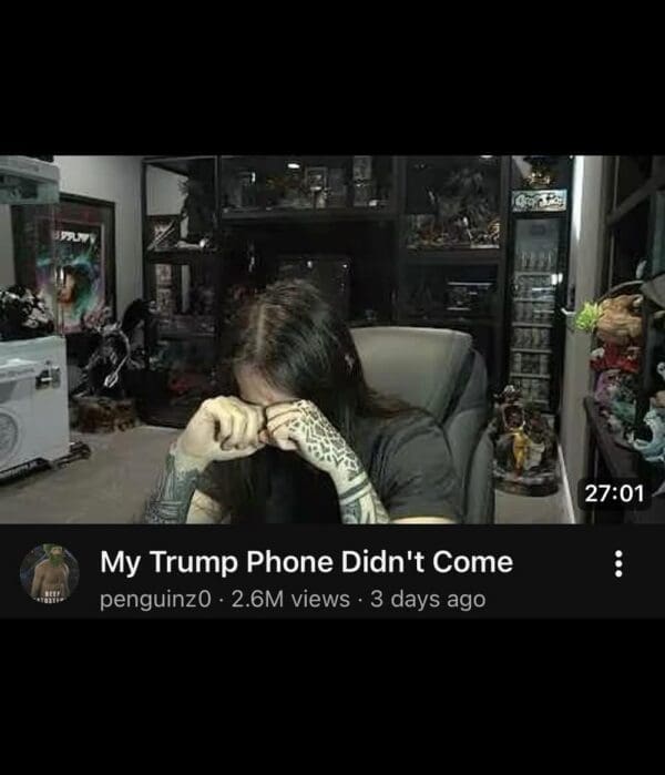 Popular internet commentator penguinz0 rubs his face in absolute exhaustion on a YouTube thumbnail titled "My Trump Phone Didn't Come," highlighting a major milestone within the community's tracking ecosystem.