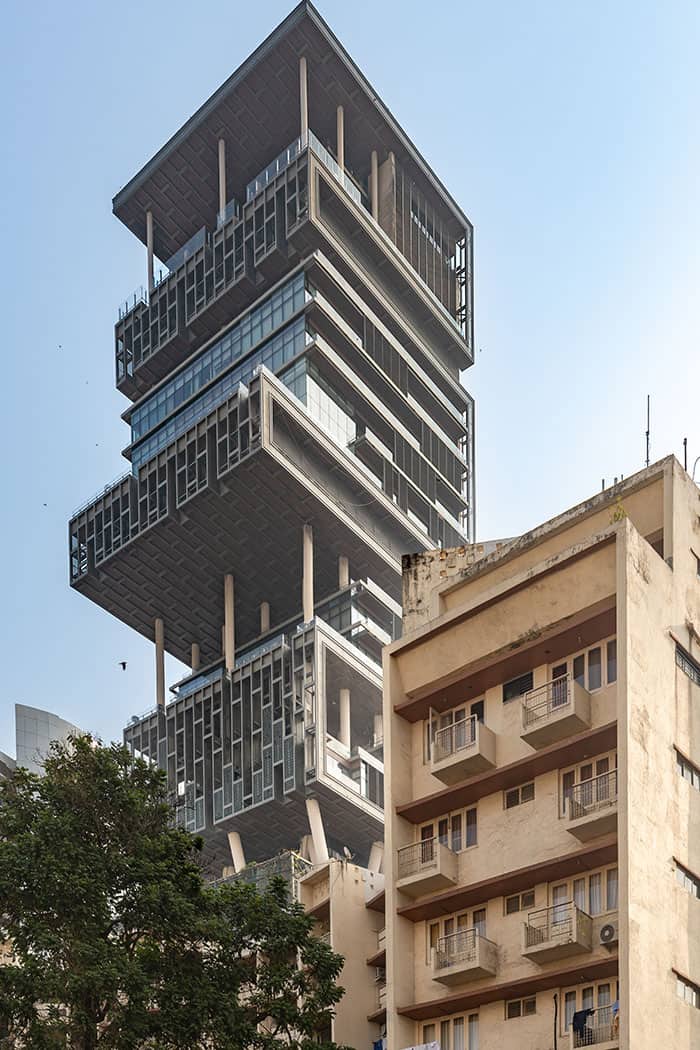 The ultra-luxurious, towering Antilia building in Mumbai with its stacked, uneven skyscraper segments.