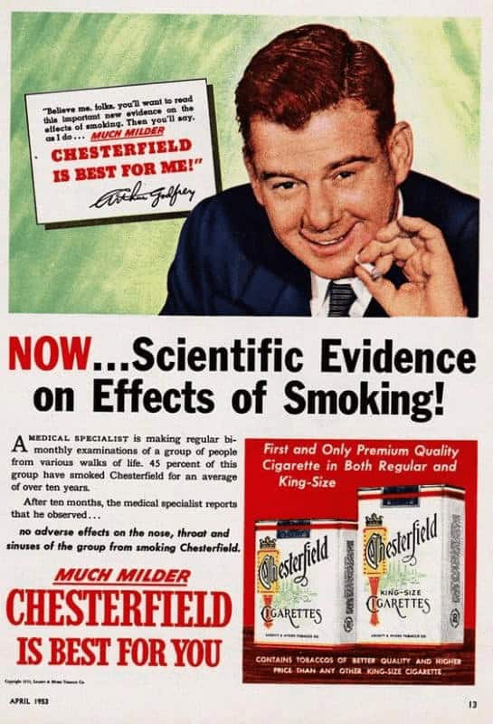 vintage cigarette ad for Chesterfield featuring radio host Arthur Godfrey, using bold red and black text to announce "Scientific Evidence" that a medical specialist found no adverse effects on the group’s health after months of smoking.