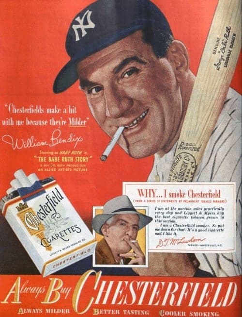vintage cigarette ad for Chesterfield starring actor William Bendix as Babe Ruth. He is wearing a Yankees cap and leaning on a baseball bat with a cigarette in his mouth, claiming Chesterfields "make a hit" because they are milder.