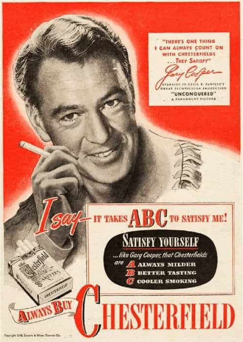 A bold red vintage cigarette ad for Chesterfield starring movie legend Gary Cooper. The ad uses the "ABC" mnemonic—Always Milder, Better Tasting, Cooler Smoking—to describe why these cigarettes are the actor's top choice.