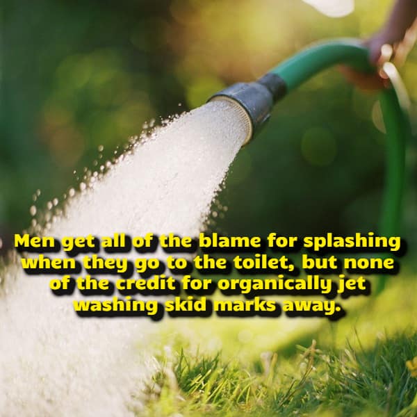 A high-pressure water stream jetting out from a green garden hose onto a lawn serves as an unexpected household metaphor for a unique visual funny shower thought about overlooked bathroom cleaning credits.