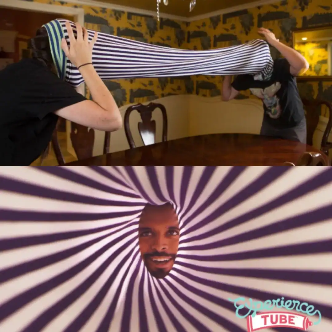 An absurdist weird product called the "Experience Tube," a long, accordion-style striped fabric tube that two people wear over their heads to stare at each other in a psychedelic void.
