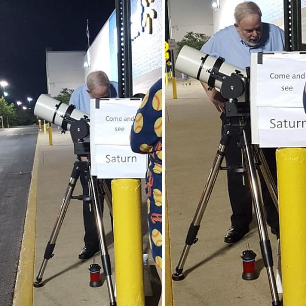 A stellar wholesome meme collage of an elderly man standing on a sidewalk outside a Walmart at night, setting up a massive professional telescope with a handmade sign inviting passersby to "Come and see Saturn."