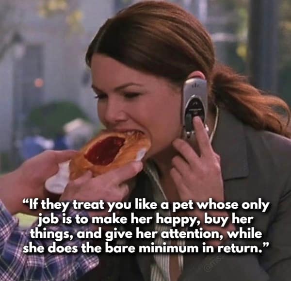 Lorelai Gilmore eating a pastry while on a flip phone highlights a scenario where women share red flags about partners who treat them like a pet—expecting constant attention and gifts while doing the bare minimum in return.