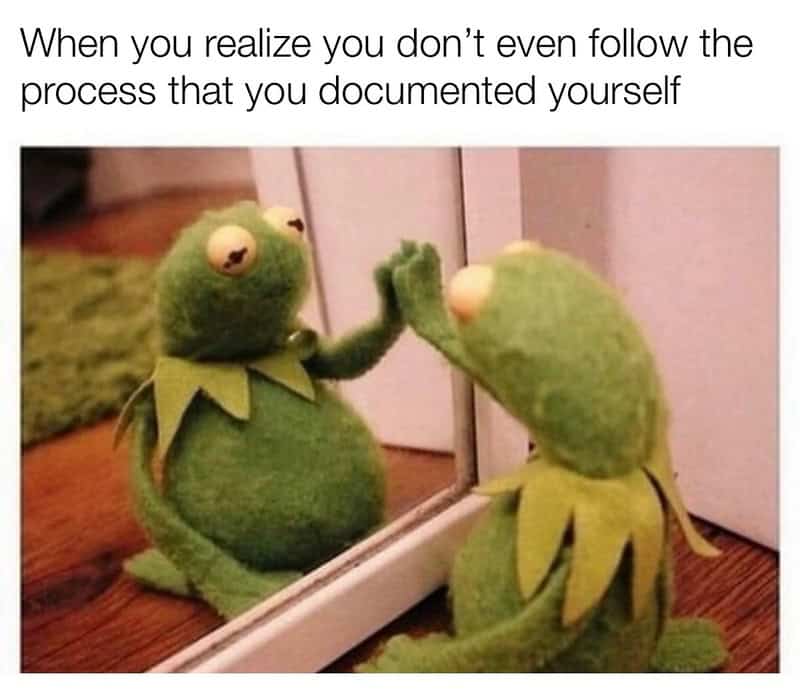 work meme featuring Kermit the Frog leaning against a mirror, staring at his own reflection in deep, existential contemplation. The text above captures the internal betrayal of realizing you don't even follow the specific workflow process that you documented yourself.