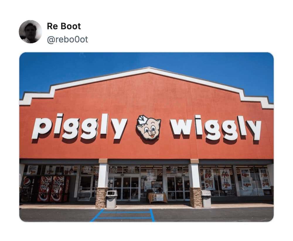 A wide shot of a "Piggly Wiggly" grocery store storefront, a classic entry in the hall of fame for worst business names due to its bizarrely rhythmic and juvenile phrasing.