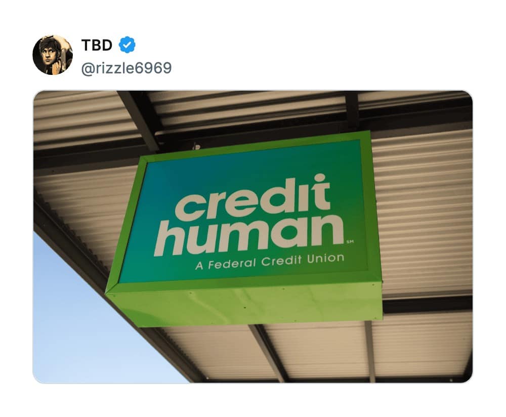 A bright green sign for "credit human," a federal credit union with one of the worst business names for its cold, clinical, and suspiciously "not-a-robot" phrasing.