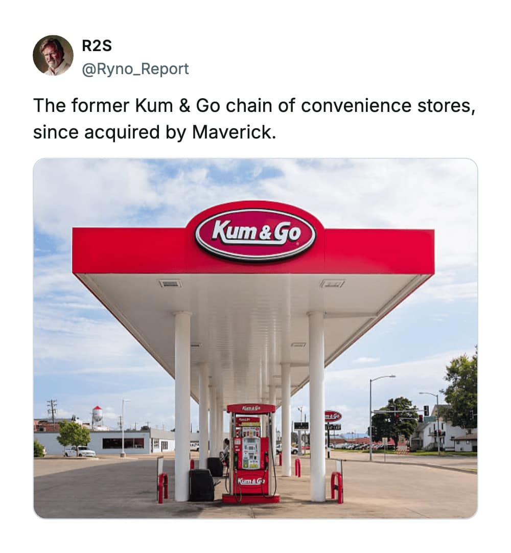 A wide view of a "Kum & Go" gas station canopy, a brand name that has become legendary among the worst business names for its overt and unfortunate sexual double entendre.